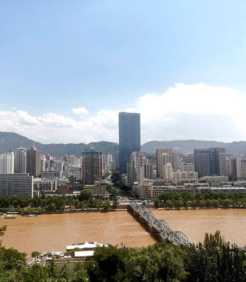 Looking down on Lanzhou from Baita Mountain in 2023; the main subject is the city, not the White Pagoda itself