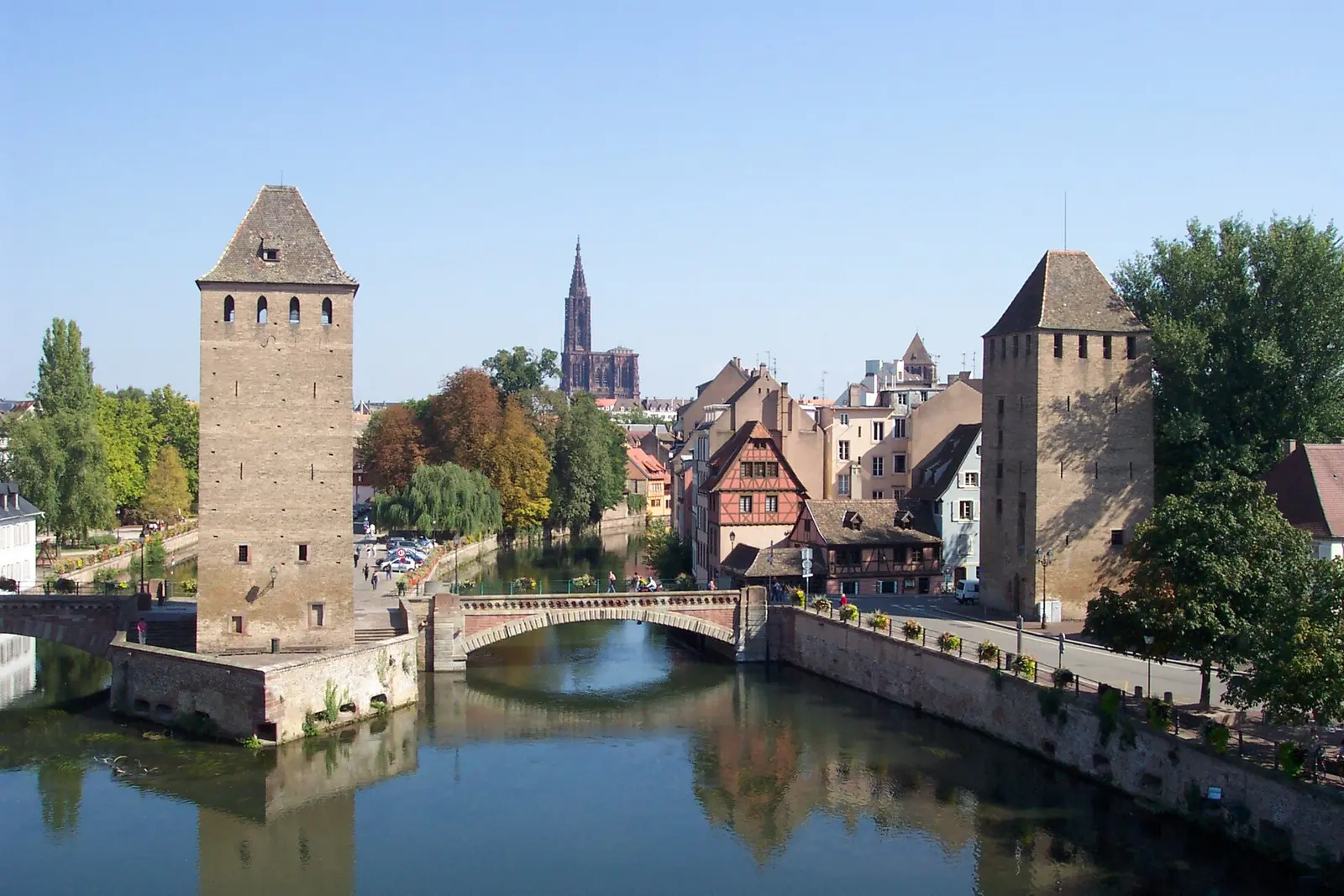 The covered bridge towers with the cathedral in the distance