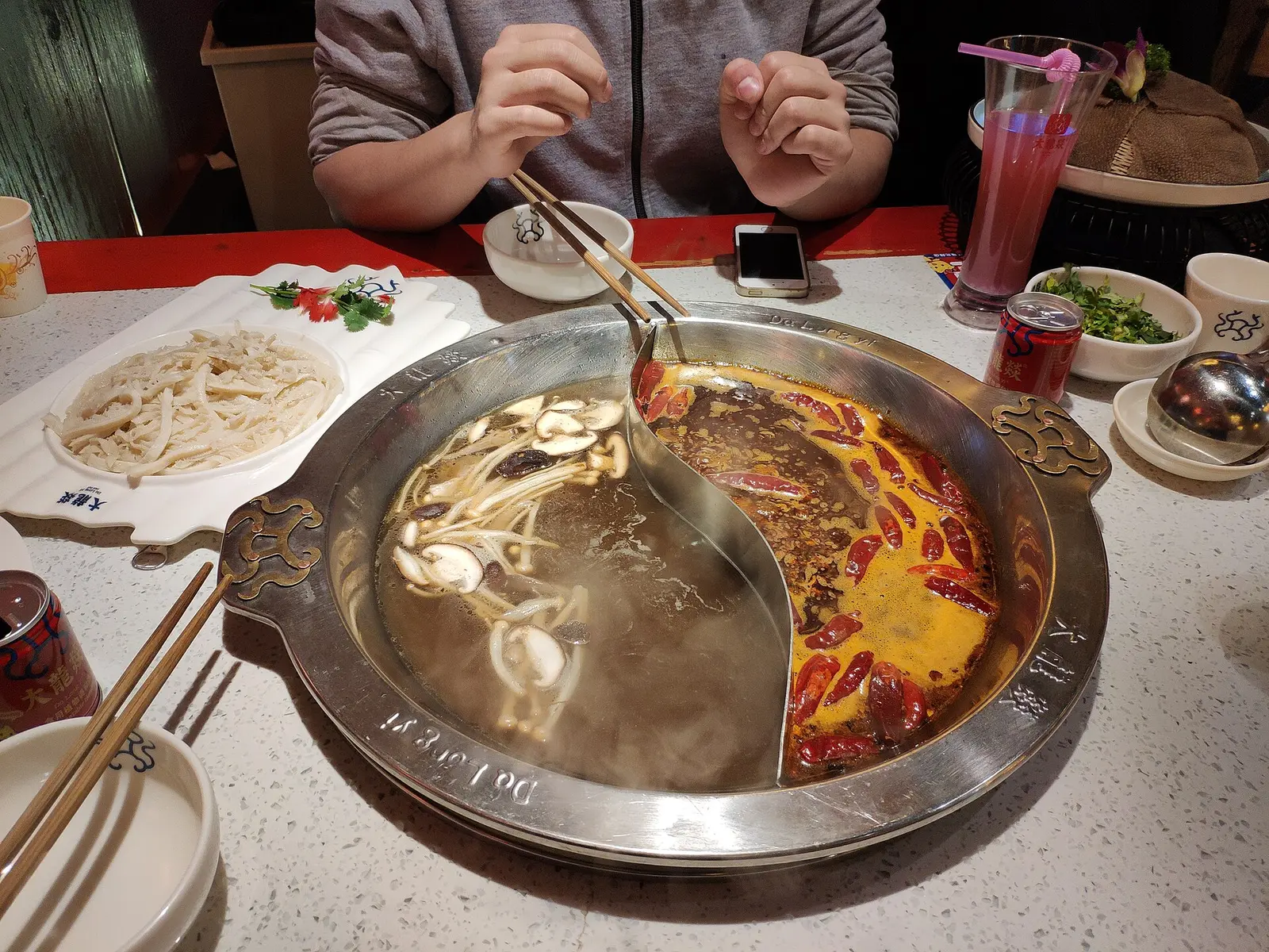 A Chengdu yuanyang pot: half spicy red mala broth, half clear broth (2019)
