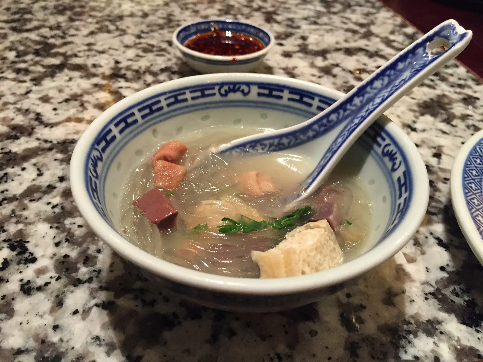 A small bowl of duck blood and vermicelli soup