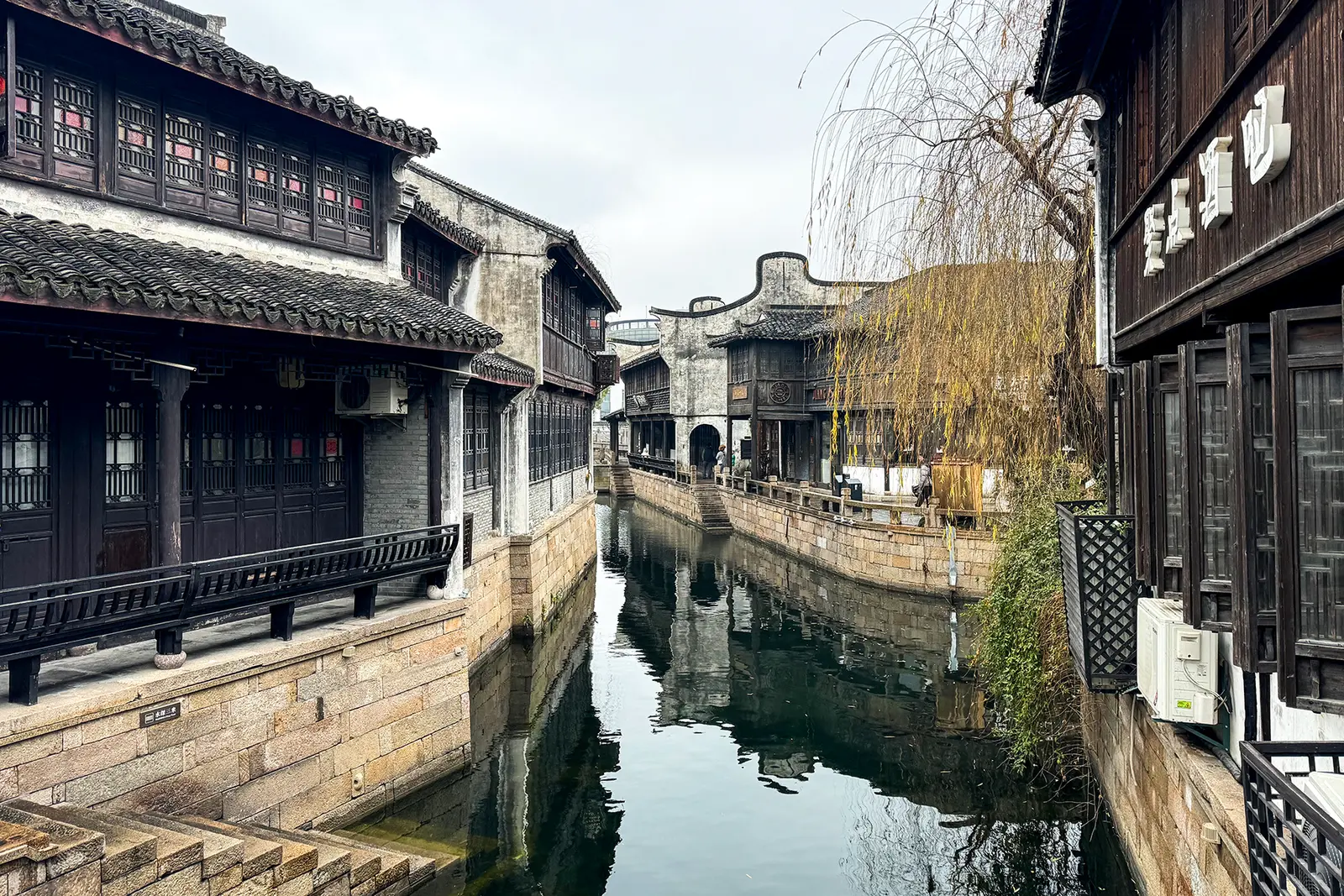 Waterway and houses in the Yuehe Historic District in January 2024