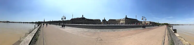 Panorama of Place de la Bourse in Bordeaux, showing 18th-century riverside architecture; not a château