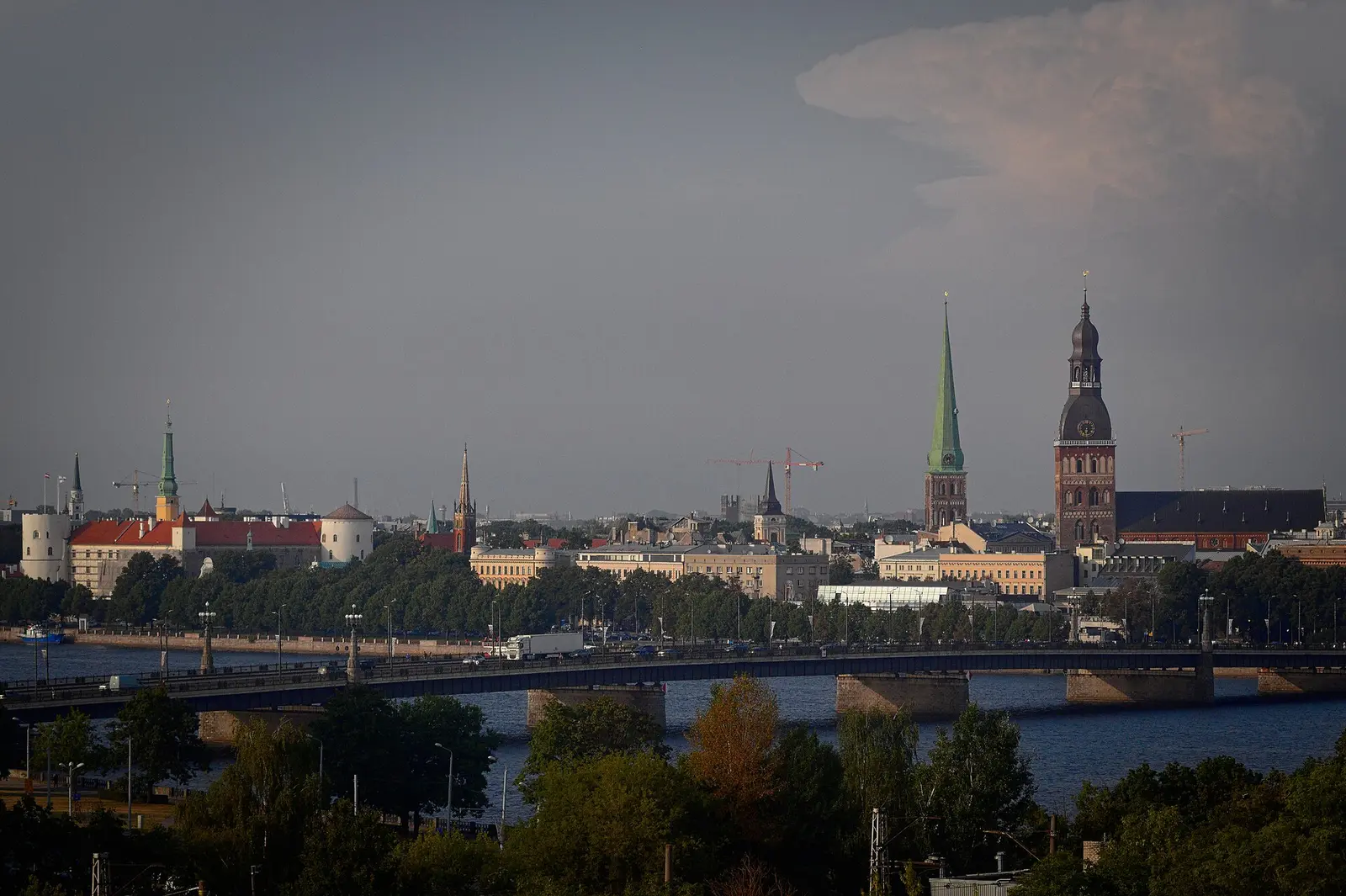 Riga Old Town's skyline and the stone bridge photographed from across the Daugava in 2022
