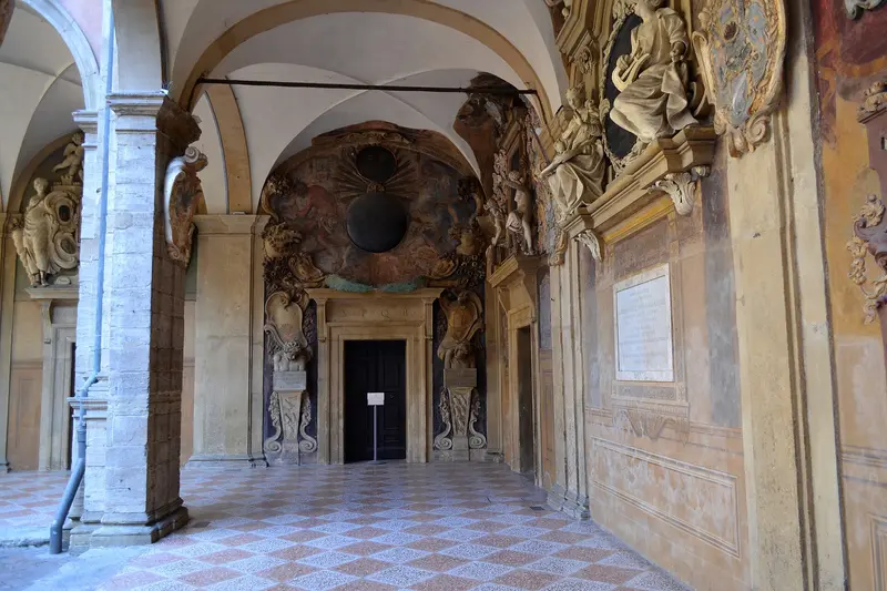 The courtyard architecture of the Archiginnasio, photographed in 2017; not the anatomical theatre and not a guarantee of opening on the day