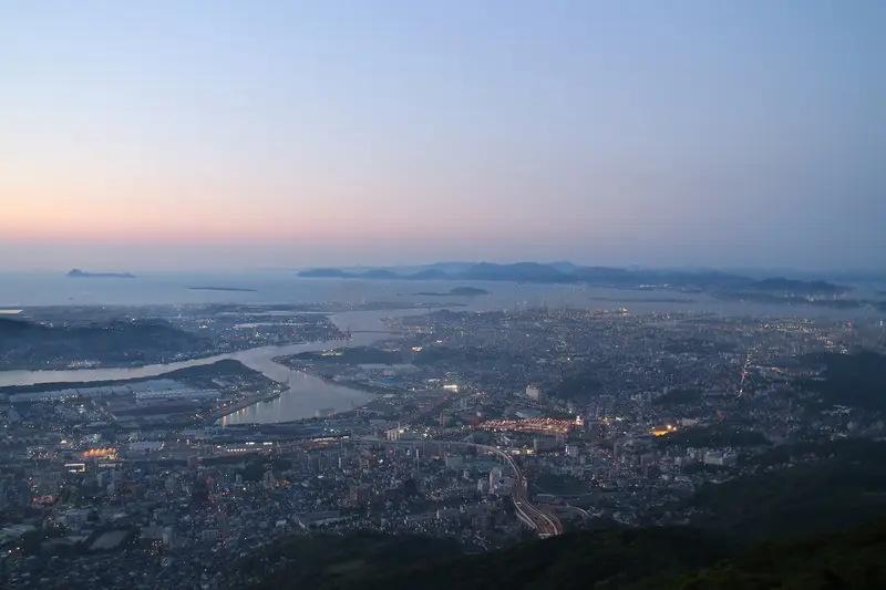 Night view of Kitakyūshū from Mount Sarakura, photographed in 2017; the visibility shown is not typical of every day